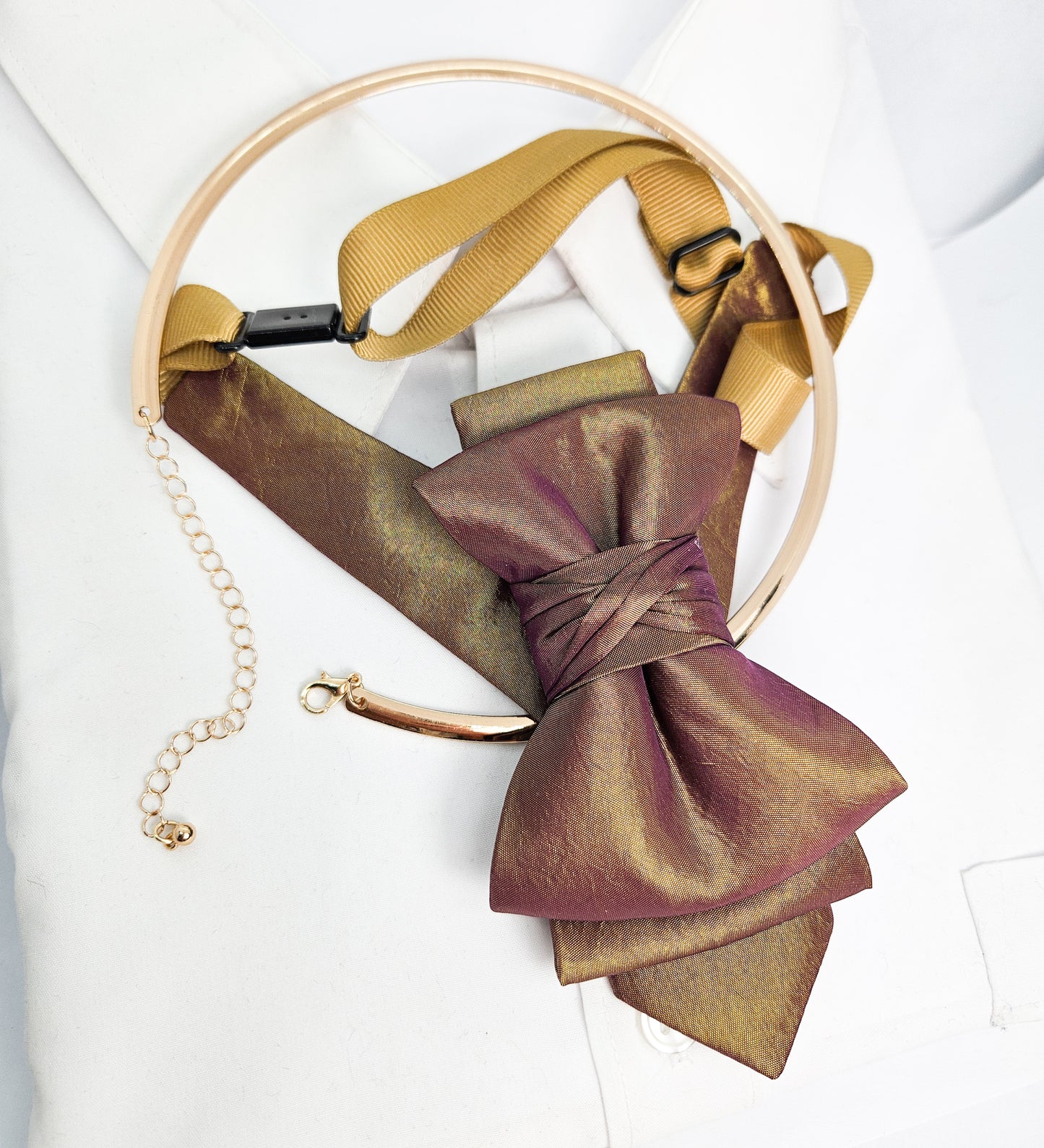 Gold and brown leather belt with a bow on a white background metallic plum gold womens necktie, bronze burgundy metallic bow tie for women, chameleon fabric neck accessory, handmade statement necktie, sculptural womens neckwear, metallic plum bronze neckpiece, luxury handmade womens neck accessory, artistic fabric necktie, modern designer womens bow tie, elegant metallic neckwear, unique womens fashion necktie, gold burgundy neck accessory, contemporary statement neckpiece