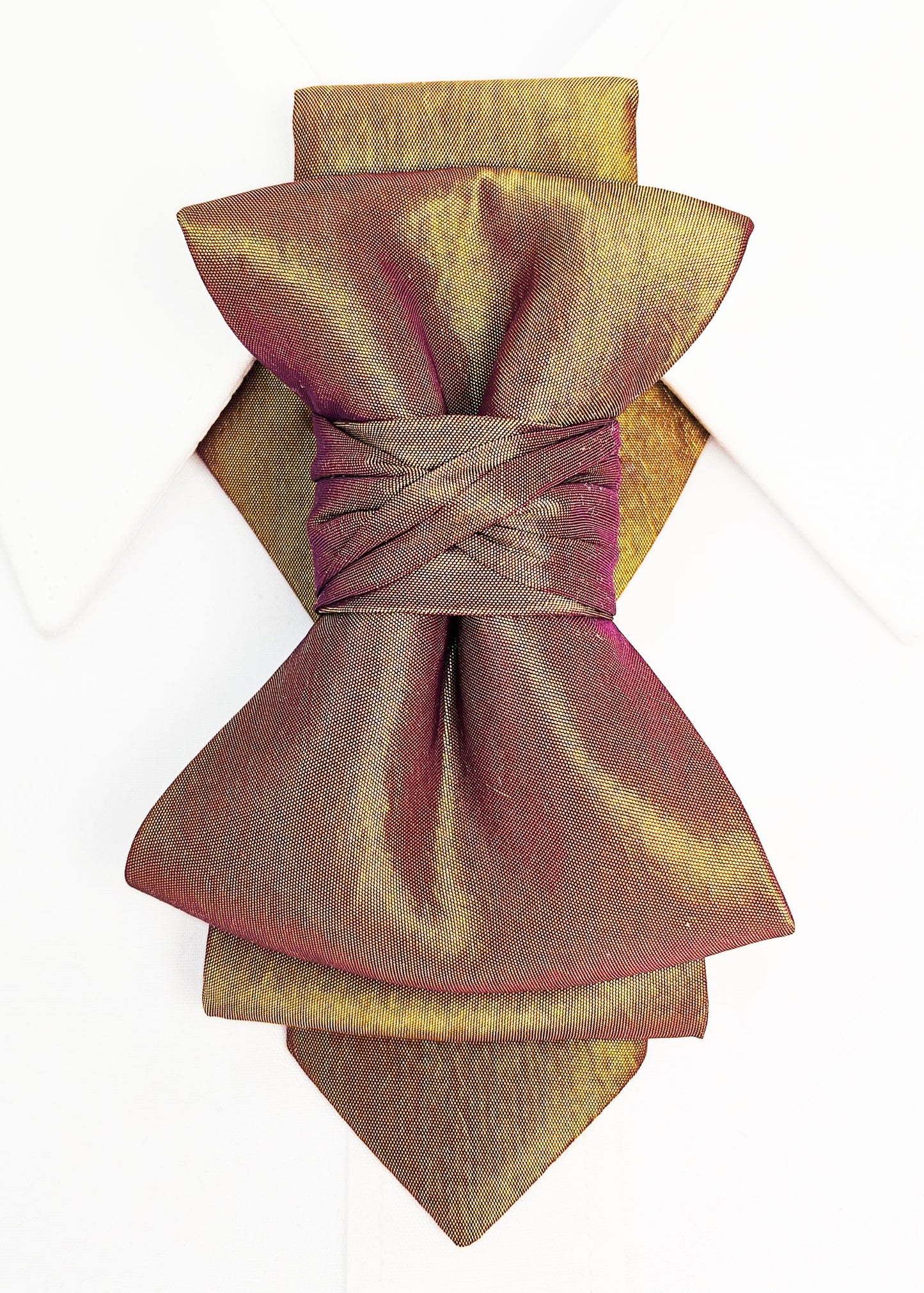 Gold and bronze bow-shaped napkin holder on a white background metallic plum gold womens necktie, bronze burgundy metallic bow tie for women, chameleon fabric neck accessory, handmade statement necktie, sculptural womens neckwear, metallic plum bronze neckpiece, luxury handmade womens neck accessory, artistic fabric necktie, modern designer womens bow tie, elegant metallic neckwear, unique womens fashion necktie, gold burgundy neck accessory, contemporary statement neckpiece
