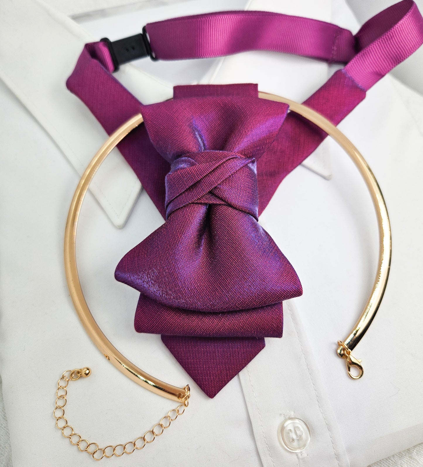 Purple bow tie and matching headband on a white shirt with gold  Handmade luxury fashion neck accessory, women's necktie accessory, purple satin necktie choker, gold choker with fabric tie, elegant women's neckwear, unique fashion accessory, stylish purple necktie for women, luxury handmade choker, modern neck accessory for women, fashionable women's tie necklace, chic and sophisticated neckpiece, bespoke fabric tie, artisan crafted neckwear, high-end ladies' accessory, formal women's tie, statement accents
