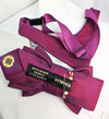 Purple bow tie with a visible brand label on a white background Handmade luxury fashion neck accessory, women's necktie accessory, purple satin necktie choker, gold choker with fabric tie, elegant women's neckwear, unique fashion accessory, stylish purple necktie for women, luxury handmade choker, modern neck accessory for women, fashionable women's tie necklace, chic and sophisticated neckpiece, bespoke fabric tie, artisan crafted neckwear, high-end ladies' accessory, formal women's tie, statement neck acc