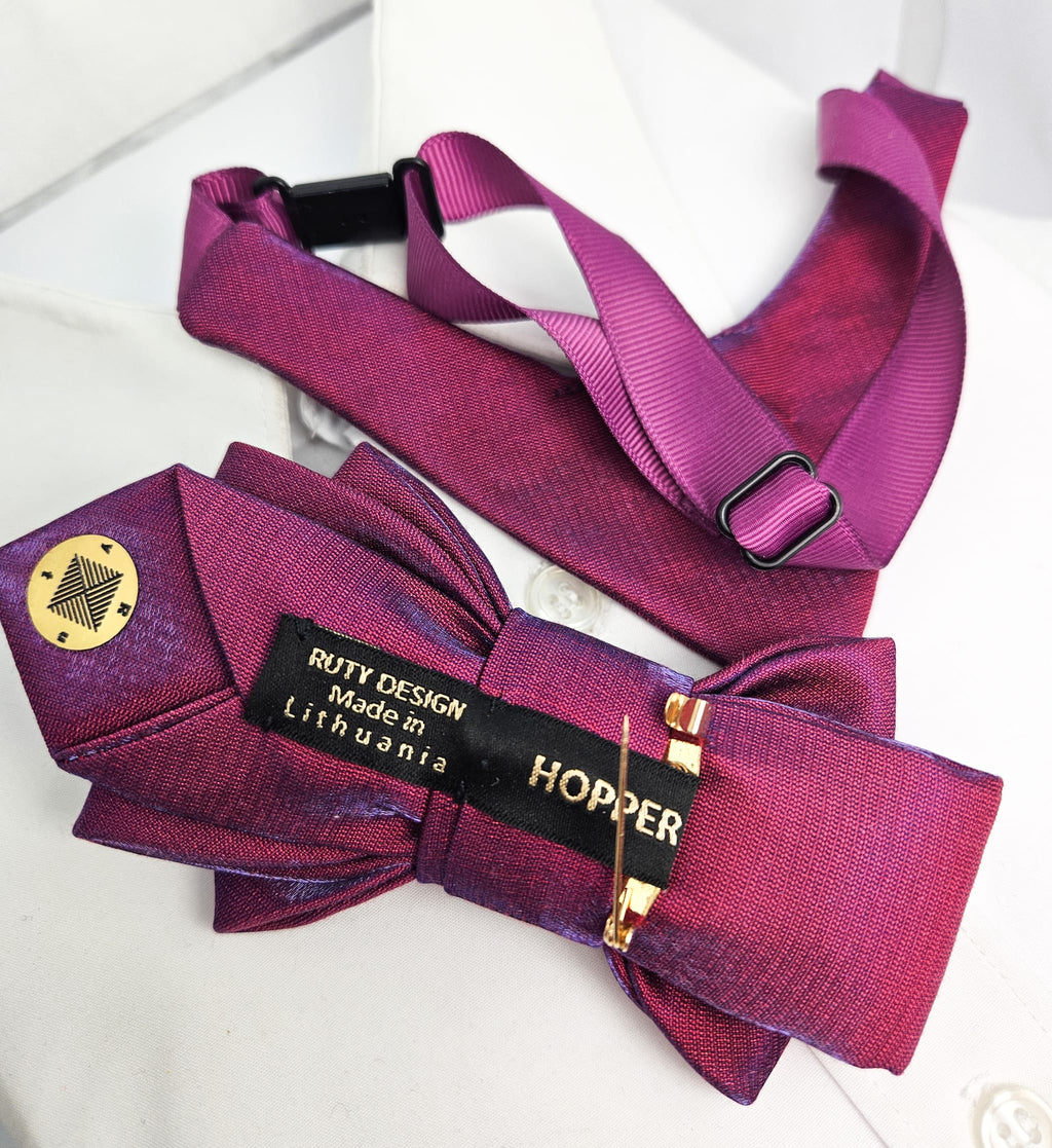 Purple bow tie with a visible brand label on a white background Handmade luxury fashion neck accessory, women's necktie accessory, purple satin necktie choker, gold choker with fabric tie, elegant women's neckwear, unique fashion accessory, stylish purple necktie for women, luxury handmade choker, modern neck accessory for women, fashionable women's tie necklace, chic and sophisticated neckpiece, bespoke fabric tie, artisan crafted neckwear, high-end ladies' accessory, formal women's tie, statement neck acc