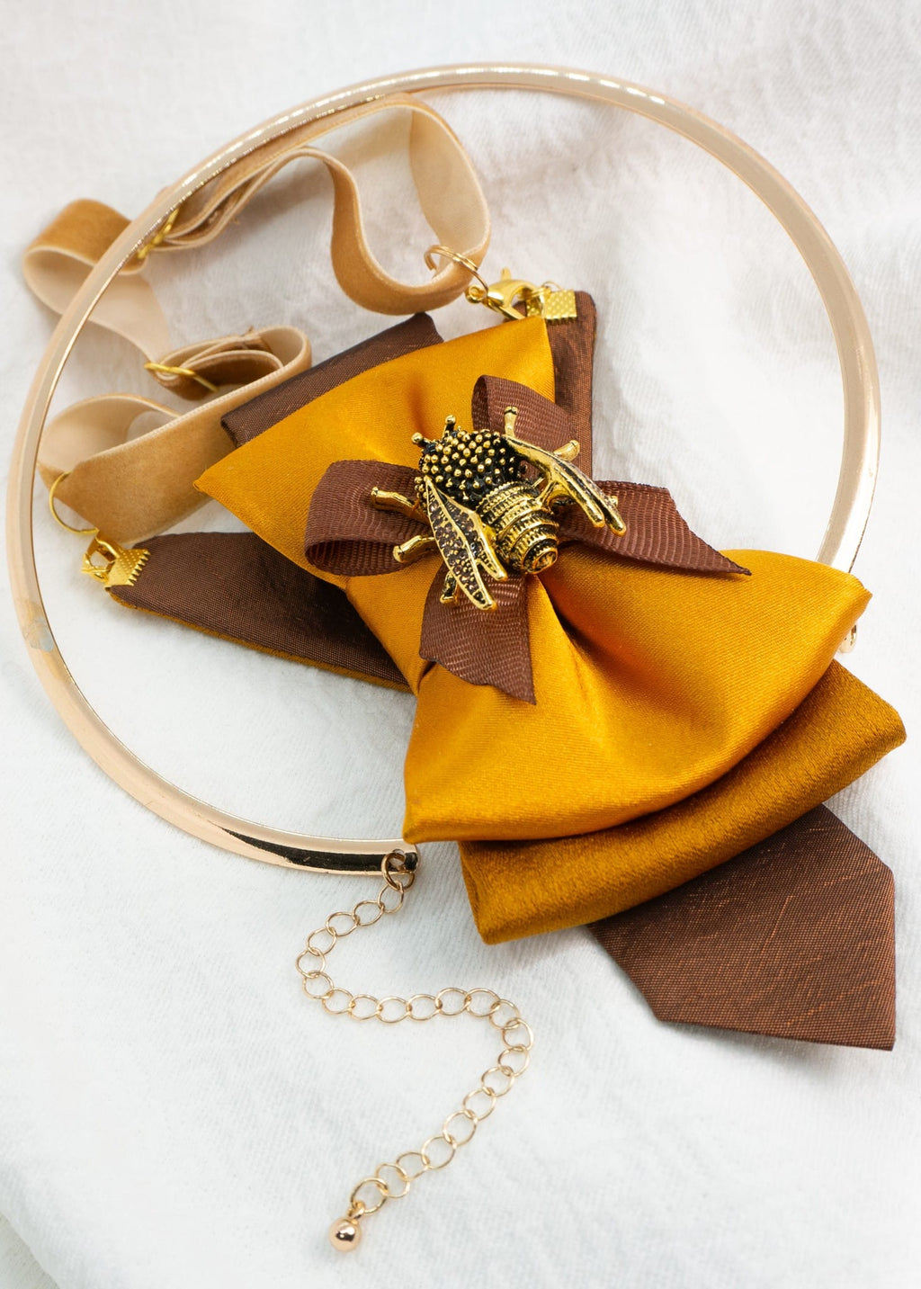 Gold bow tie for women transformed into a unique pendant accessory