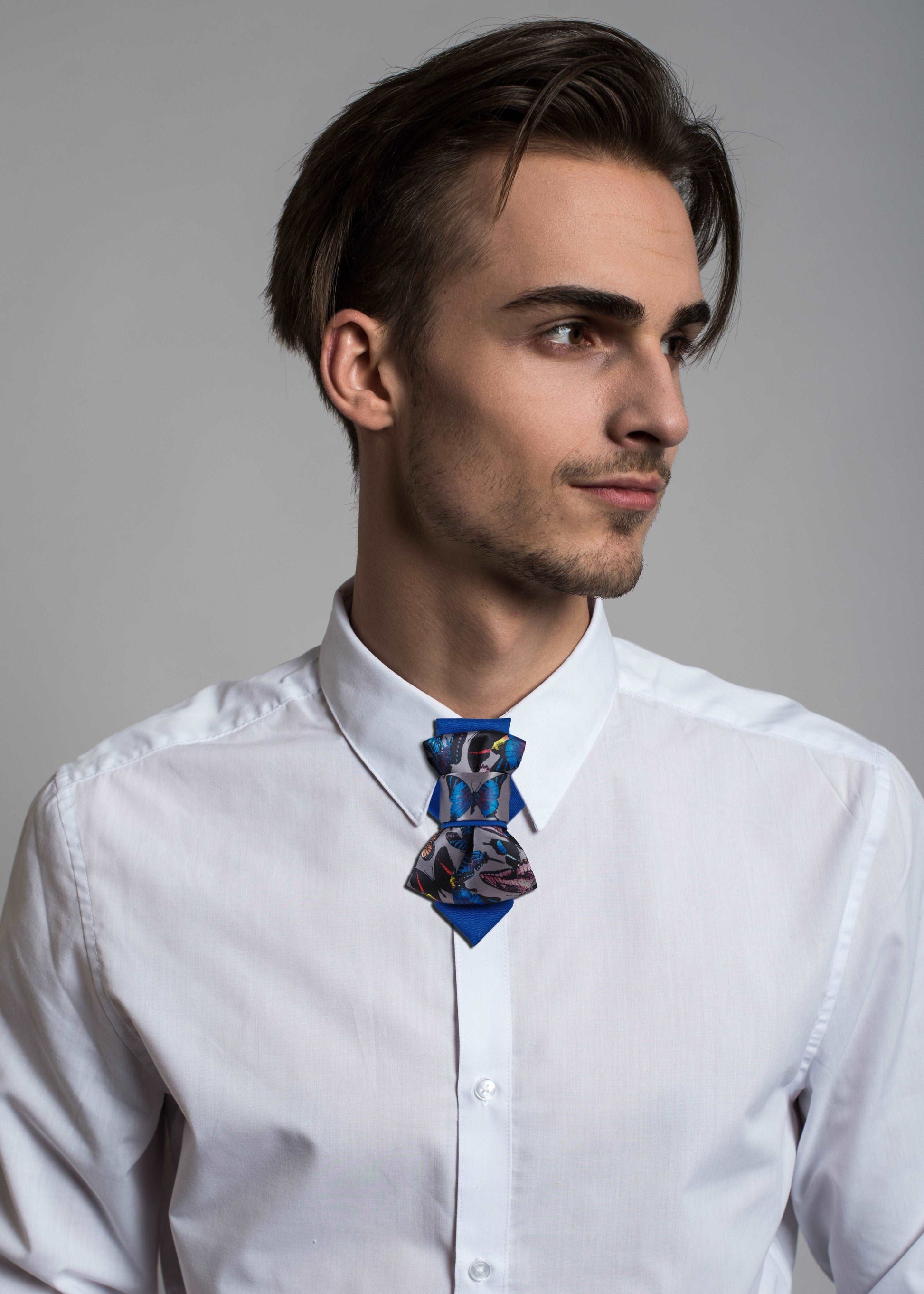 Handmade blue bow tie with butterfly print, Pre-tied bow tie for special occasions, Elegant unisex accessory with colorful butterflies, Blue bow tie with vibrant butterfly pattern, Luxury butterfly bow tie in gift box, Family-friendly handmade tie from Lithuania, Stylish blue bow tie for all ages, Fashion bow tie designed by Rūta Piekurienė