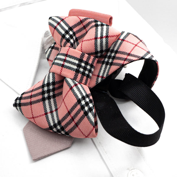 Plaid bow hair accessory on a white background