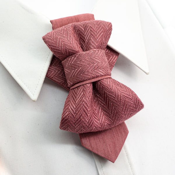 Pink woven bow tie on a white background handmade pink wedding necktie, luxury artisan bow tie for groom, unique layered pink tie, elegant textured fabric necktie, modern unisex neckwear, herringbone woven linen tie, handmade men’s fashion accessory, luxury pink tie for special occasions, artistic formal necktie, handcrafted groom outfit accessory