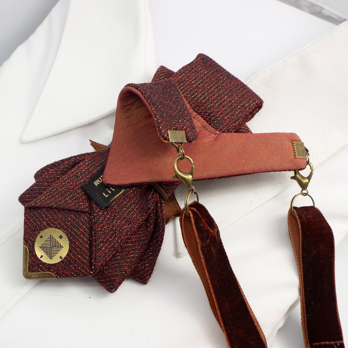 Women's luxury tie
Elegant caramel-colored tie
Chameleon fabric necktie
Brown, burgundy, and gold tie
Handmade women's tie
Textured matte fabric tie
Ribbon and bee embellishment tie
Statement fashion accessory
Unique conversation starter tie
High-quality artisan tie
Refined women's neckwear
Sophisticated tie with bee detail
Warm-toned luxury necktie
Stylish tie for women
Designer handmade necktie