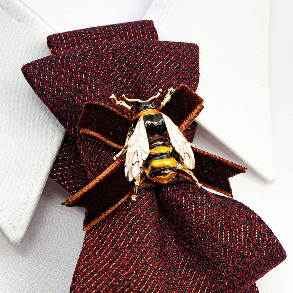 Women's luxury tie
Elegant caramel-colored tie
Chameleon fabric necktie
Brown, burgundy, and gold tie
Handmade women's tie
Textured matte fabric tie
Ribbon and bee embellishment tie
Statement fashion accessory
Unique conversation starter tie
High-quality artisan tie
Refined women's neckwear
Sophisticated tie with bee detail
Warm-toned luxury necktie
Stylish tie for women
Designer handmade necktie
