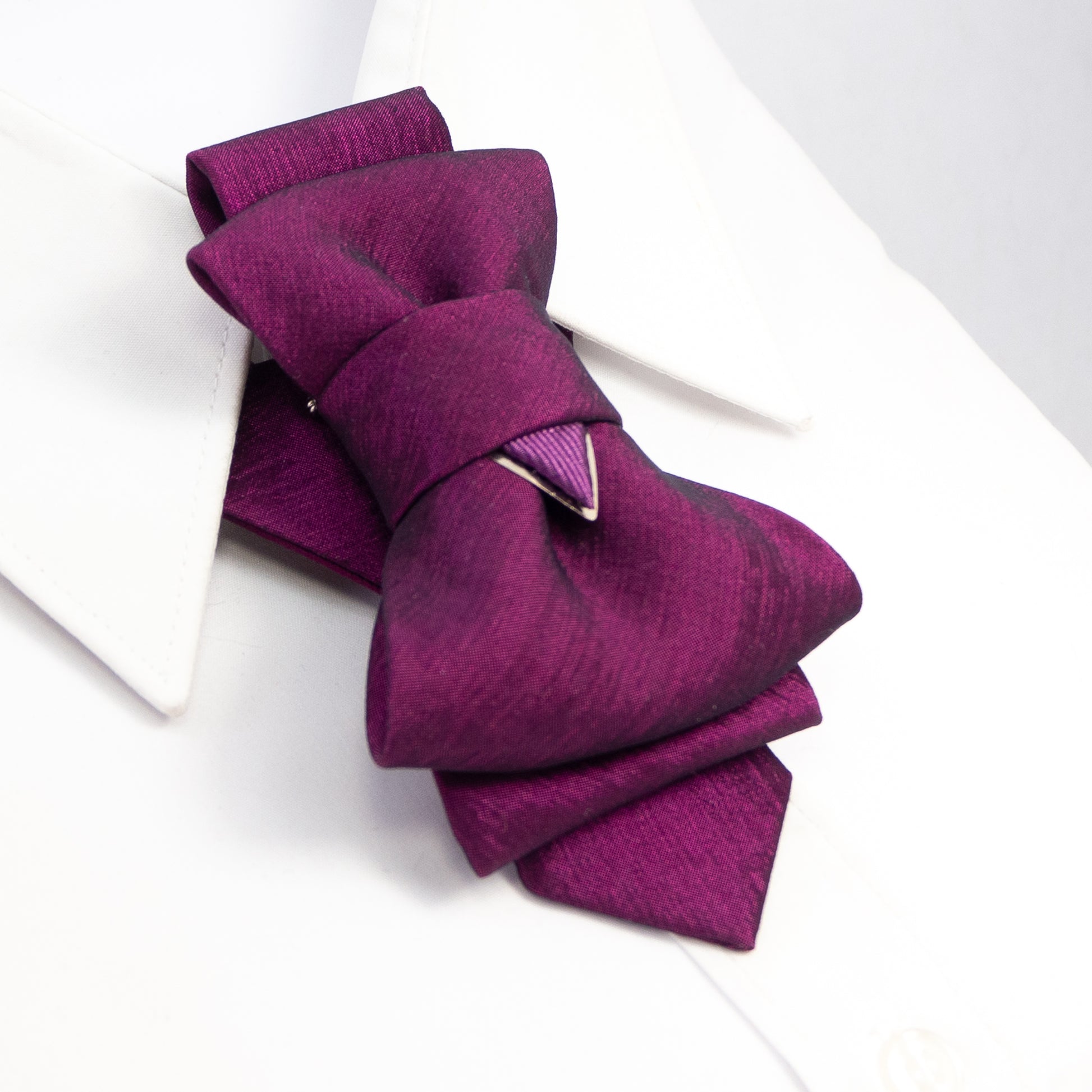 Purple necktie accessory on a person wearing a purple top against a beige background Purple bow-shaped necklace on a model against a beige background HOPPER TIE CYCLAMEN FOR LADIES, Unique bow ties, Designer bow ties, Handmade bow ties, Fashion bow ties, Statement bow ties, Creative bow ties, Stylish bow ties, Trendy bow ties, Colourful bow ties, Bold bow ties, Funky bow ties, Artistic bow ties, Handmade purple necktie, Unique women's necktie, Elegant purple necktie, Custom necktie for women, High-quality p