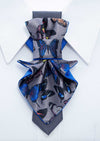 Jabot blue tie for women, blue bow tie for ladies, handmade luxury women’s necktie, butterfly jabot tie, gray and blue butterfly pattern tie, artistic women’s neck accessory, statement bow tie for women, sculptural fabric tie accessory, modern jabot necklace tie, elegant women’s tie for weddings, unique designer necktie for women, butterfly print fashion accessory, avant garde women’s tie, luxury handmade tie Lithuania, Rūta Piekurienė design tie, stylish accessory for musicians women, formal artistic neckw