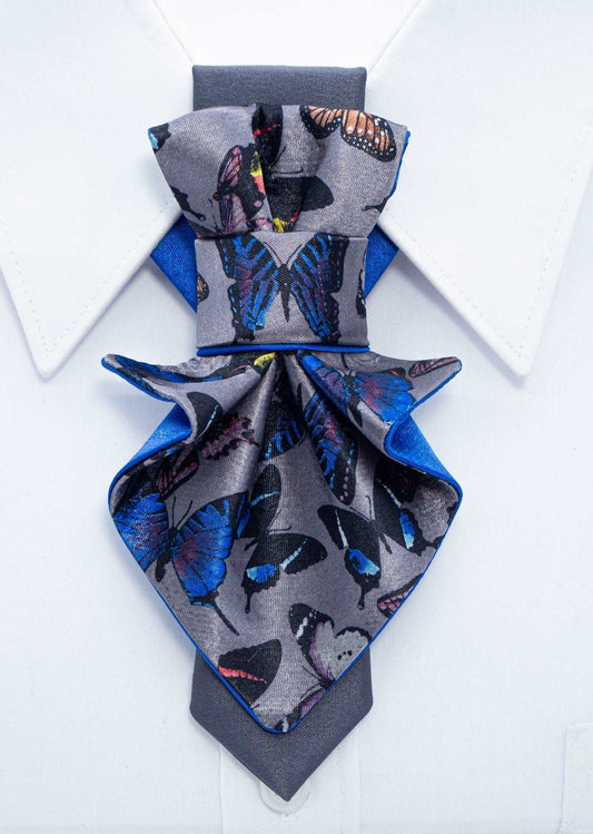 Jabot blue tie for women, blue bow tie for ladies, handmade luxury women’s necktie, butterfly jabot tie, gray and blue butterfly pattern tie, artistic women’s neck accessory, statement bow tie for women, sculptural fabric tie accessory, modern jabot necklace tie, elegant women’s tie for weddings, unique designer necktie for women, butterfly print fashion accessory, avant garde women’s tie, luxury handmade tie Lithuania, Rūta Piekurienė design tie, stylish accessory for musicians women, formal artistic neckw
