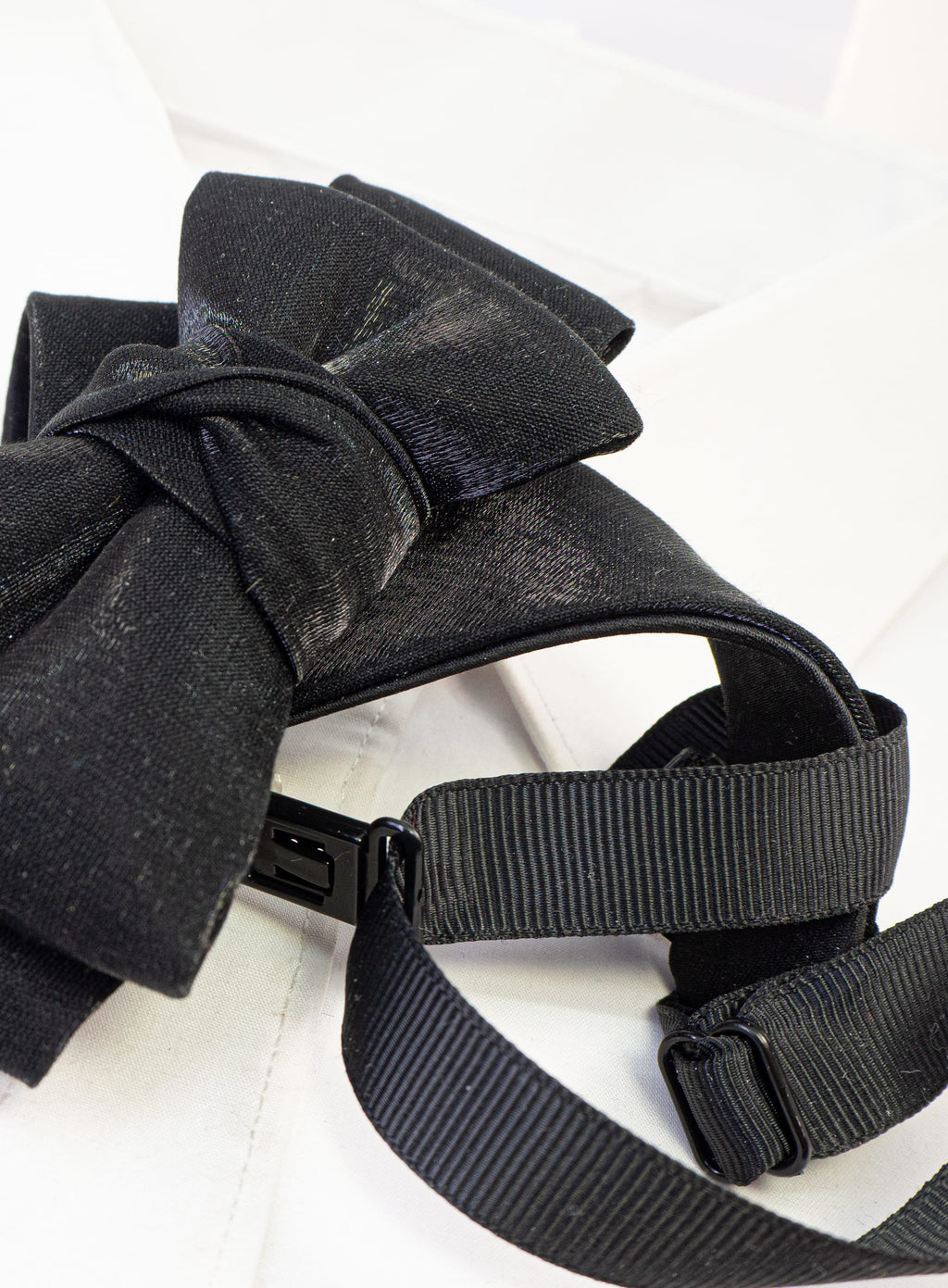 black statement tie for men, sculptural bow tie alternative, unique formal neckwear, artistic groom tie, modern wedding tie, luxury handmade necktie, sophisticated men fashion, elegant men accessory, designer neckwear piece, standout wedding look, contemporary cravat style tie, tailored suit accessory, refined black necktie, avant garde tie, formal event accessory, minimalist black tie, premium fabric tie, stylish groom outfit detail