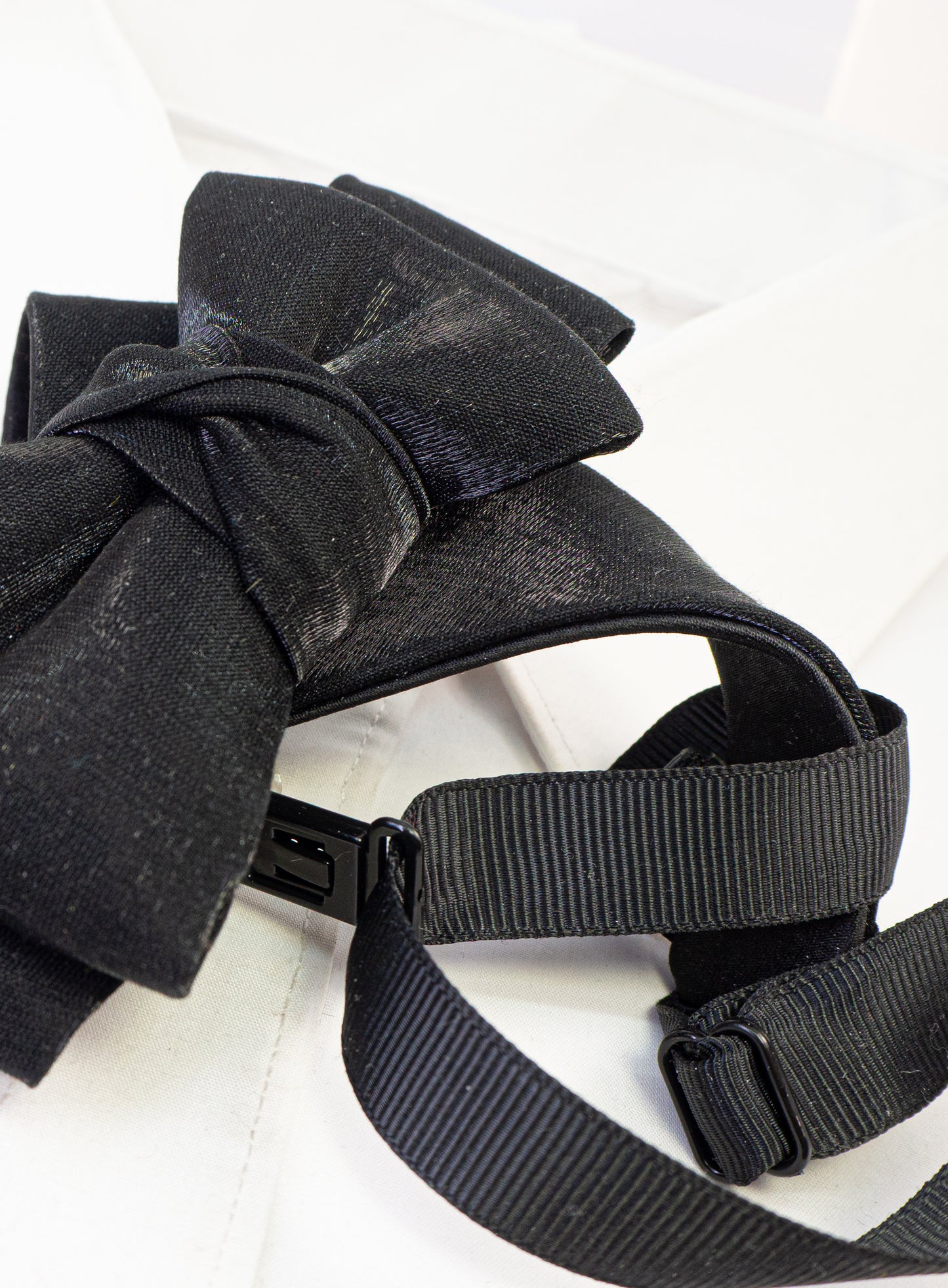 black statement tie for men, sculptural bow tie alternative, unique formal neckwear, artistic groom tie, modern wedding tie, luxury handmade necktie, sophisticated men fashion, elegant men accessory, designer neckwear piece, standout wedding look, contemporary cravat style tie, tailored suit accessory, refined black necktie, avant garde tie, formal event accessory, minimalist black tie, premium fabric tie, stylish groom outfit detail