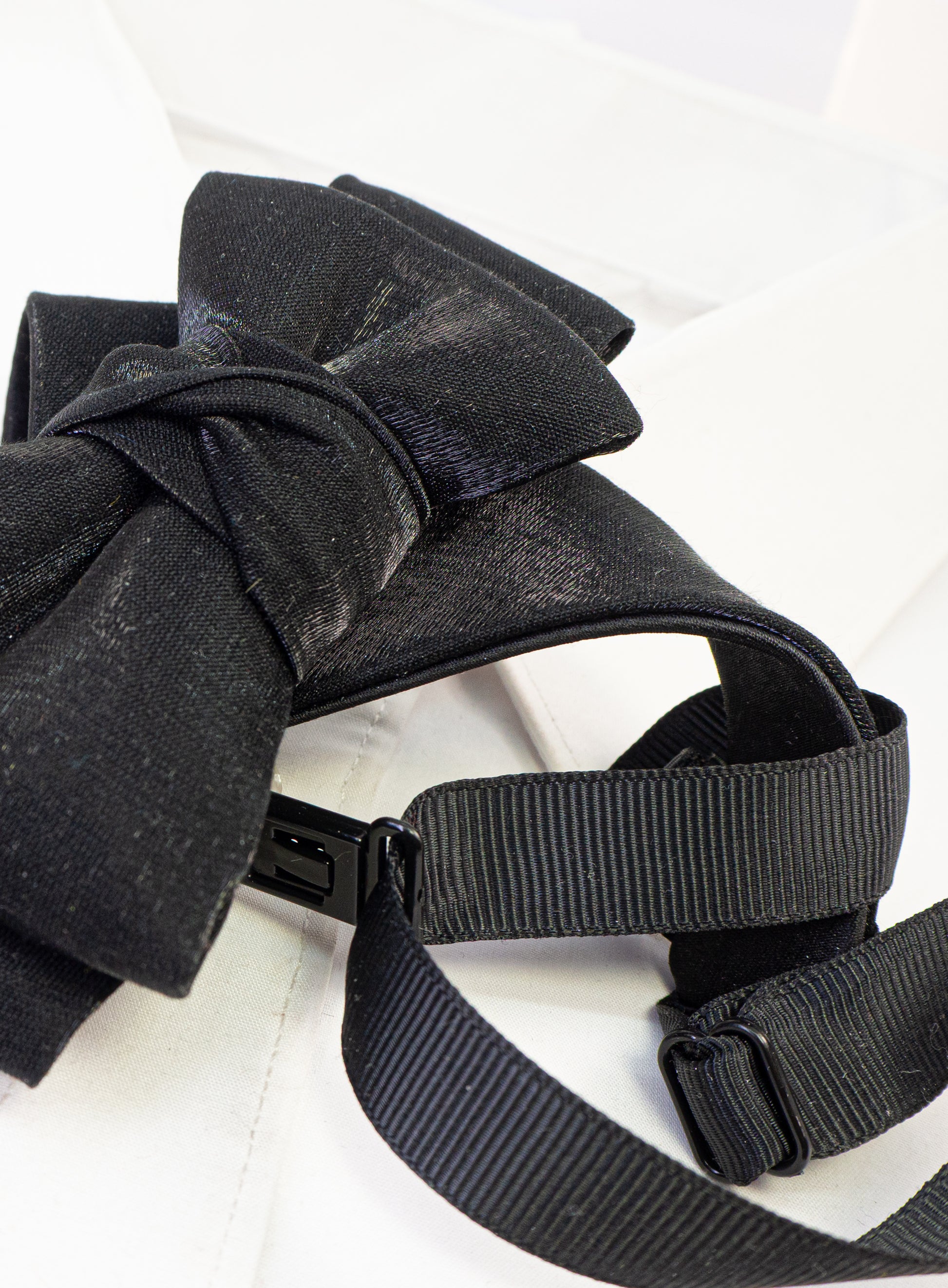 black statement tie for men, sculptural bow tie alternative, unique formal neckwear, artistic groom tie, modern wedding tie, luxury handmade necktie, sophisticated men fashion, elegant men accessory, designer neckwear piece, standout wedding look, contemporary cravat style tie, tailored suit accessory, refined black necktie, avant garde tie, formal event accessory, minimalist black tie, premium fabric tie, stylish groom outfit detail