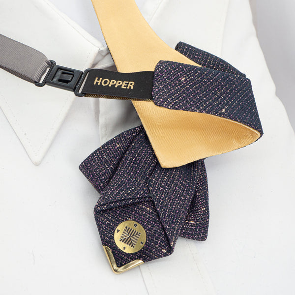 Navy textured bow tie with gold accents on a white background Exclusive handmade jabot necktie in shimmering black with gold and purple details, accented with Gediminas Pillars symbol. Luxury wedding tie for groom or guest, perfect accessory for cultural gatherings, ceremonies, and elegant evening wear. Unique artisan craftsmanship, high-quality Lithuanian design.