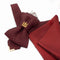 Red and black striped bow tie with a pocket square on a white background red black striped jabot tie, gold Gedimino stulpai emblem, handmade heritage necktie, Lithuanian cultural fashion, artisan jabot-style tie, elegant striped tie gold badge, luxury heritage necktie, cultural fashion accessory, Lithuanian identity tie, formal jabot tie, handcrafted Lithuanian motif tie