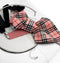 Pink plaid bow tie with a black and white pattern on a white surface Handmade luxury women’s necktie accessory in pink plaid design, unique wedding and special occasion neckwear, elegant fashion statement tie, modern alternative to bow tie, handcrafted designer accessory for bride, bridesmaid, or stylish guest, exclusive feminine neck accessory, chic and artistic neckwear gift, original handmade women’s fashion detail for parties, events, and luxury outfits.
