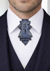 uxury handmade ascot tie close up, navy blue paisley ascot tie, silk ascot tie on white shirt, men formal neckwear detail, elegant cravat tie front view, artisan made ascot tie, premium men neck accessory, wedding groom ascot tie, stage performer formal tie, unique paisley necktie texture, luxury menswear accessory closeup, sophisticated formal tie design