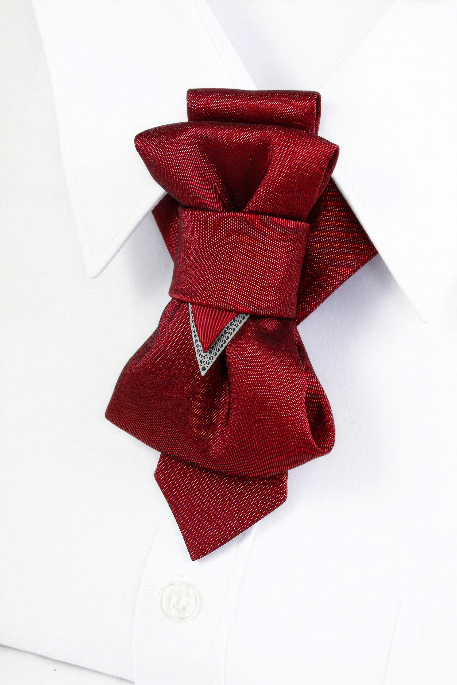 Red wedding necktie, unique design, handmade, luxury, close-up, white shirt, formal wear, special occasion, bespoke, elegant, sophisticated, stylish, vibrant red, intricate folds, detailed craftsmanship, high-quality fabric, fashion accessory, groom attire, distinguished, statement piece, exclusive, modern, chic, timeless, celebratory, memorable, opulent, refined, sharp, dapper, sartorial, personalized, exclusive, eye-catching, festive, grand, striking, suave, tasteful, distinguished, exceptional, polished,
