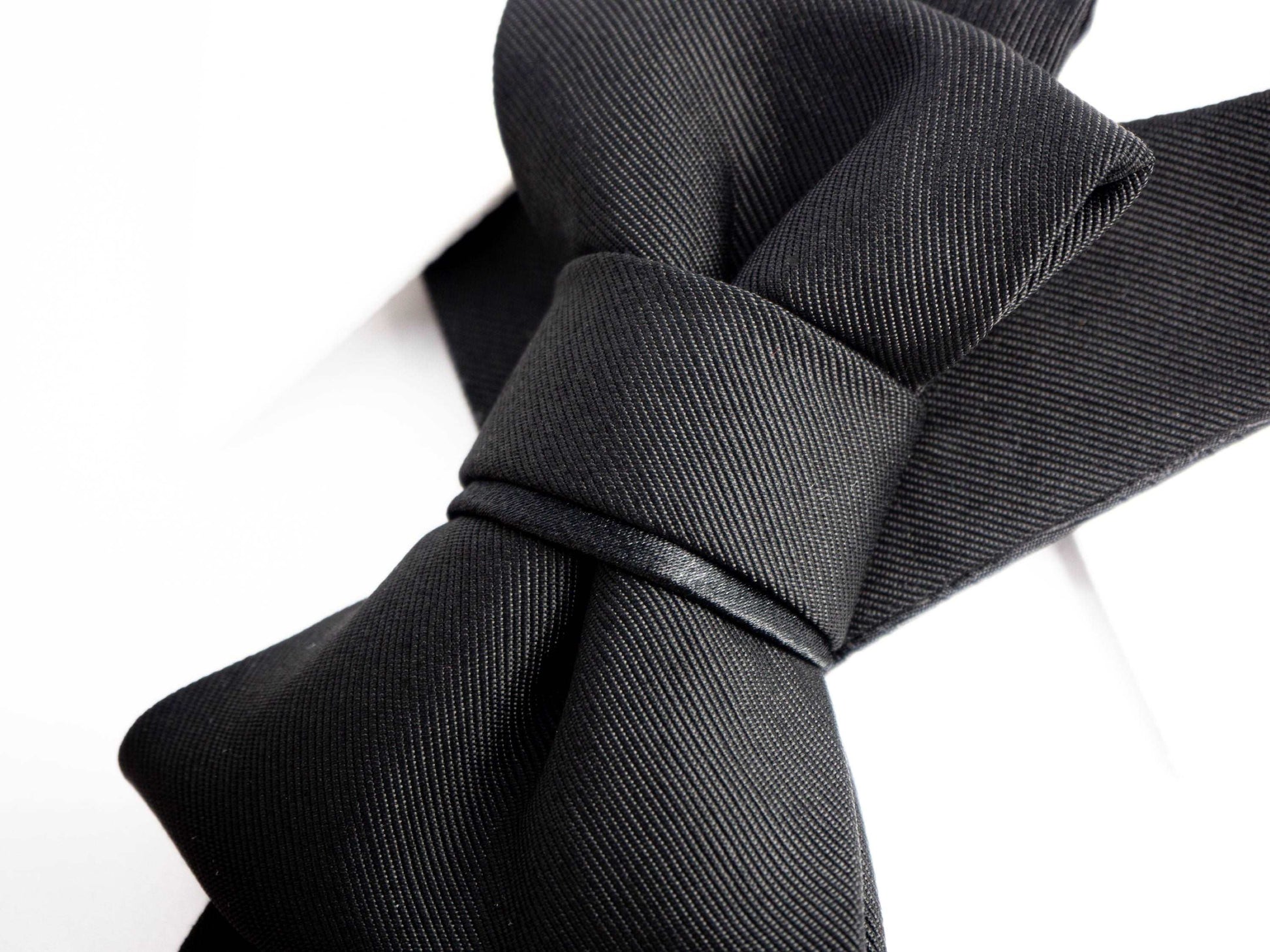 Classic black handmade men tie close up view