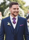 Man in a blue suit with a purple tie and pocket square at an outdoor event grrom tie, purple striped necktie, blue suit, outdoor wedding, elegant, smiling
Men's wedding necktie, unique purple pattern, elegant bow tie, formal wear, groom attire
Designer cravat, sophisticated men's accessory, striped bow tie, luxury wedding fashion
Purple striped necktie, boutonniere, wedding suit, stylish groom, formal event