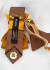 Back view of the gold bow tie showing the authentic Ruty Design handmade label