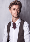 Man wearing a white shirt, brown vest, and burgundy bow tie against a gray background Bow Tie, Tie for wedding suite MERLOT II hopper tie Bow tie, groomer tie bordeaux bow tie, handmade necktie, luxury wedding tie, vertical layered tie, merlot color tie, groom accessory, elegant menswear, performer neckwear, artistic bow tie, chevron pattern tie, red wine color tie, unique handmade tie, ruty design tie