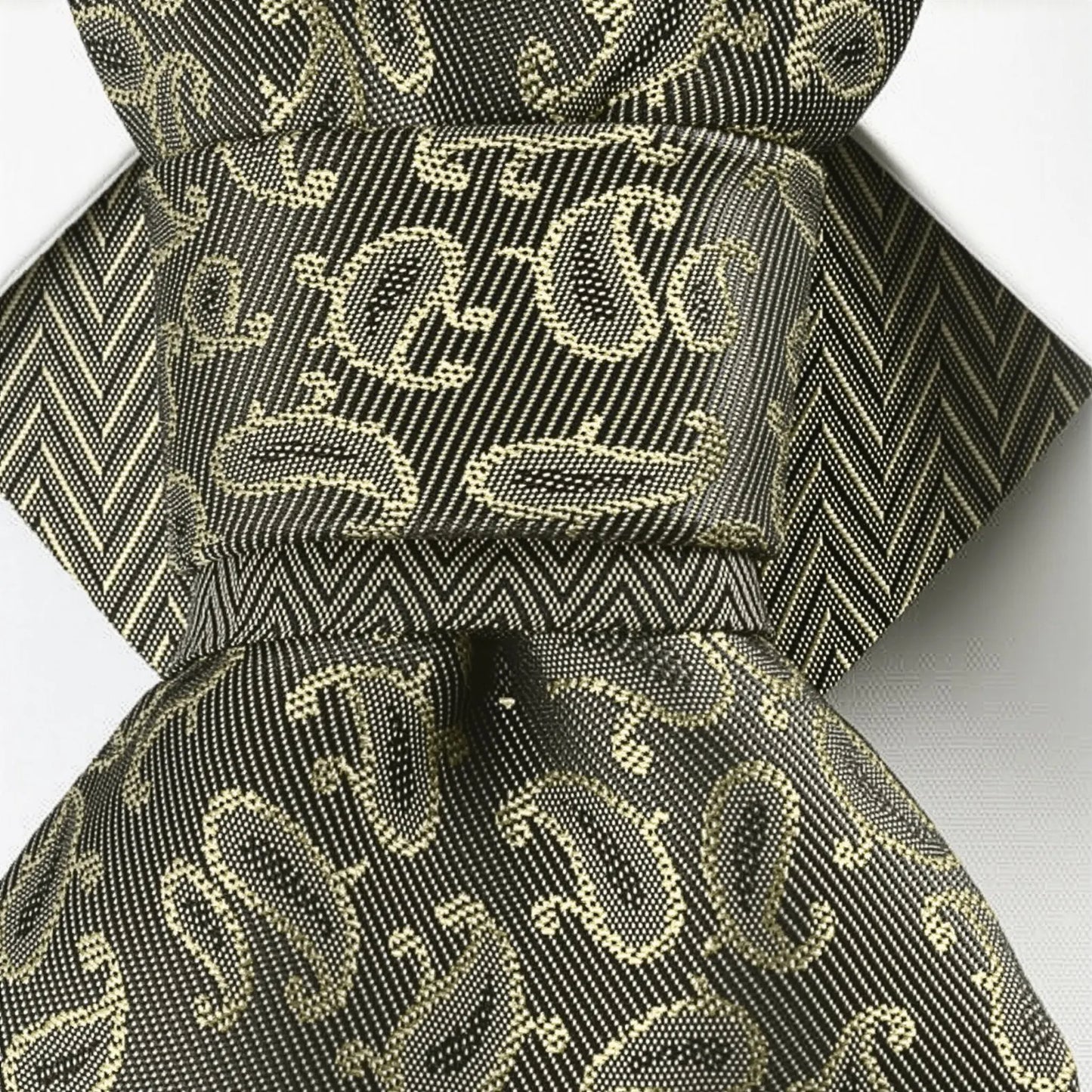 Black and gold patterned fabric with a bow on a white background Bow Tie, Tie for wedding suite SAFARI hopper tie Bow tie 
A black and gold silk ascot tie with a detailed paisley pattern, worn with a classic white dress shirt. The tie features a chevron stripe texture, creating a sophisticated and formal look. It's a handmade luxury wedding accessory