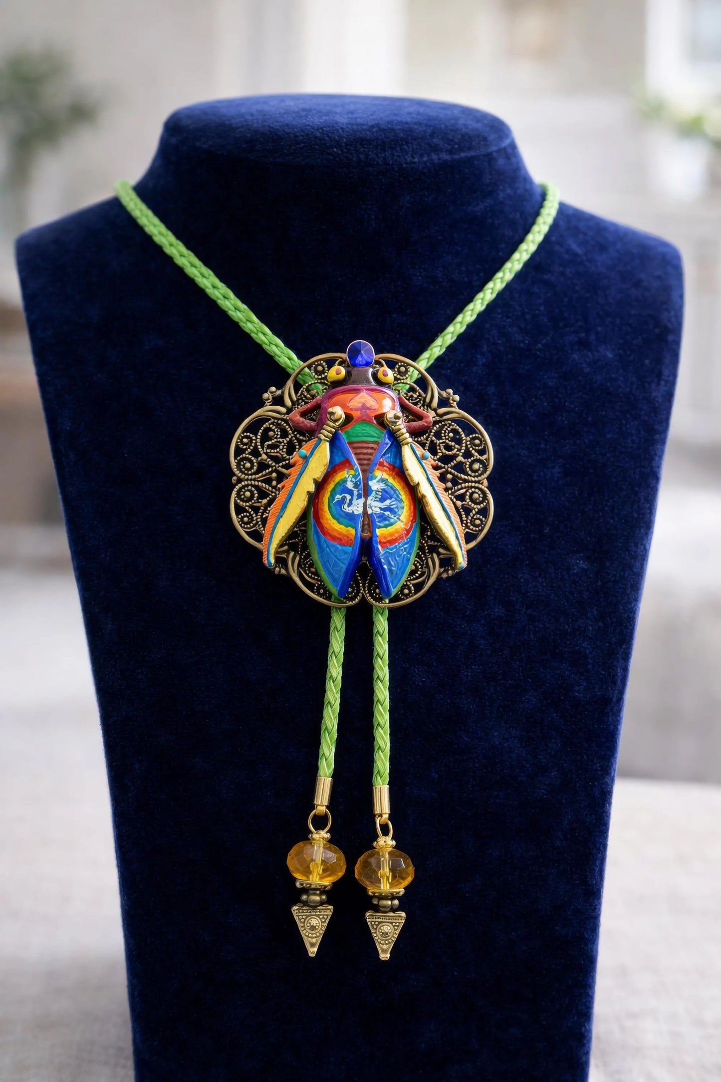 Colorful necklace with a decorative pendant on a blue velvet stand Luxury art pendant for special occasions, Sophisticated wearable art jewelry styling, Unique gift for art lover woman, Meaningful original art gift for her, Collector miniature painting jewelry piece, One of a kind handmade pendant gift idea, Artistic luxury jewelry for refined taste, Exclusive author jewelry by Marijus Piekuras