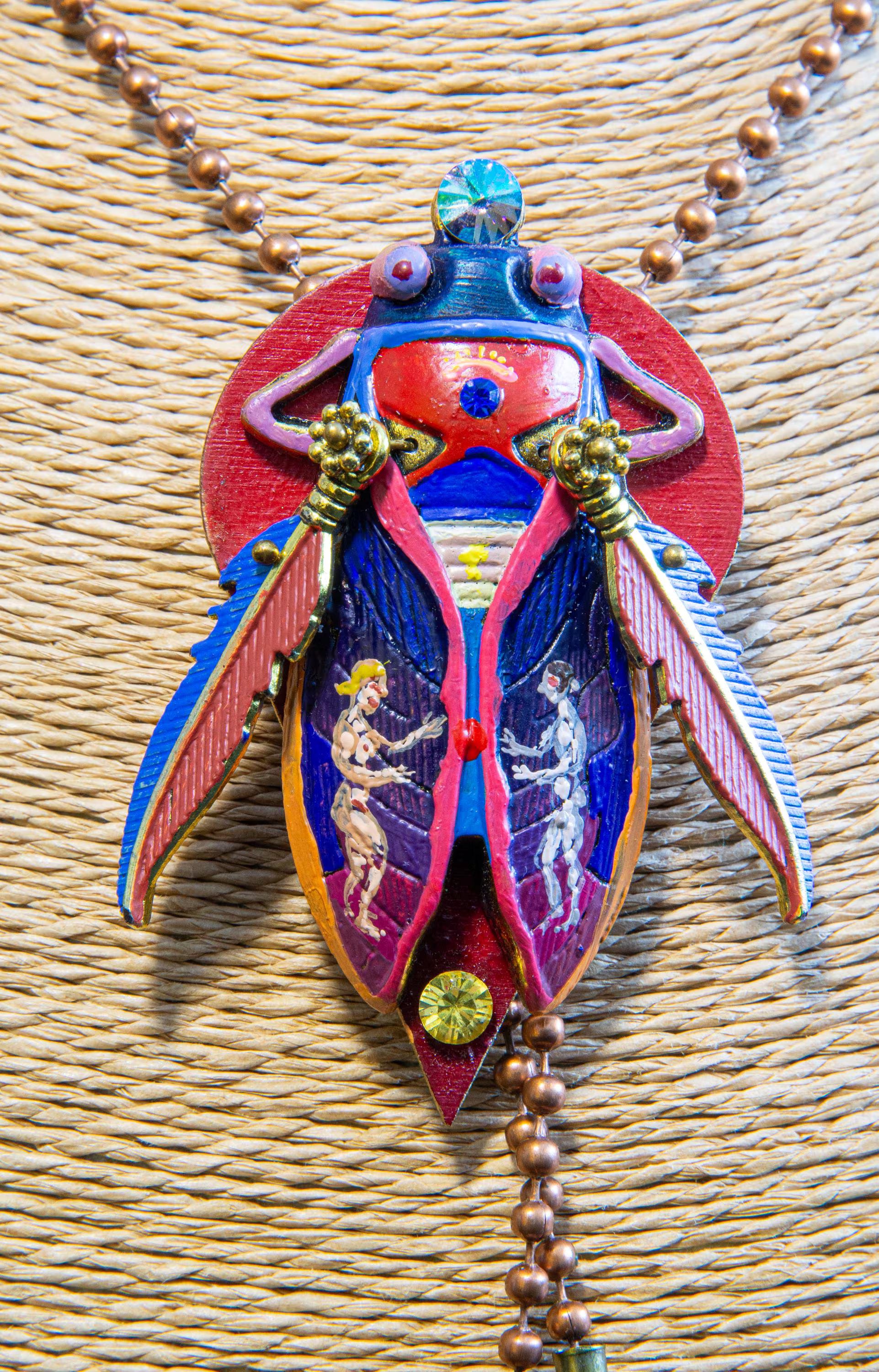 Colorful beetle-shaped pendant with intricate designs on a textured surface unique gift for her, art lover gift, handmade jewelry gift, collectible art necklace, luxury statement gift, anniversary gift idea, birthday gift for wife, gift for creative woman, meaningful artistic jewelry, museum style pendant gift, renaissance inspired necklace, fantasy insect jewelry, heirloom style accessory, artisan designer necklace, special occasion jewelry, romantic gift idea, Christmas gift for her, Valentine gift jewelr