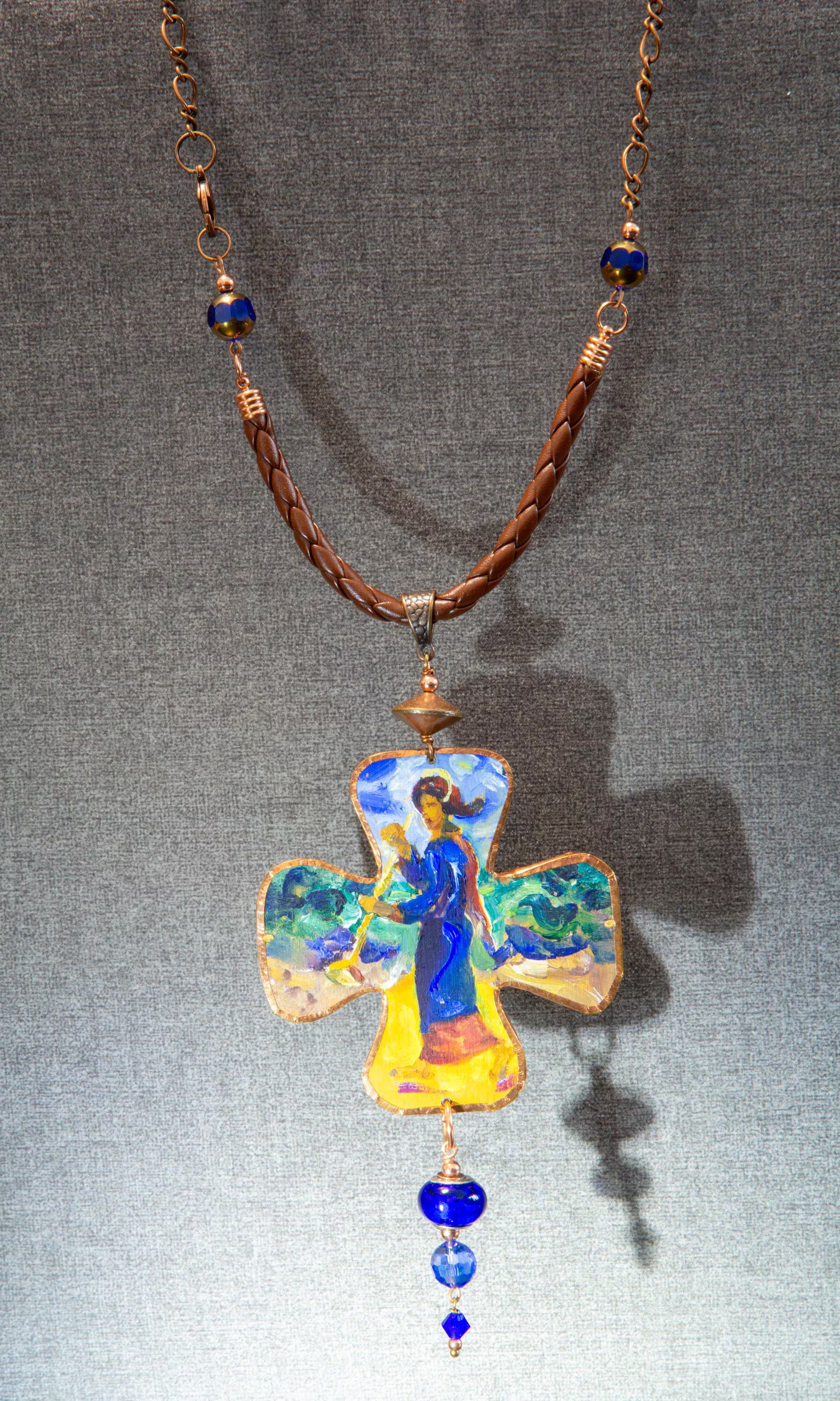 Necklace with a cross pendant featuring an angel on a gray background