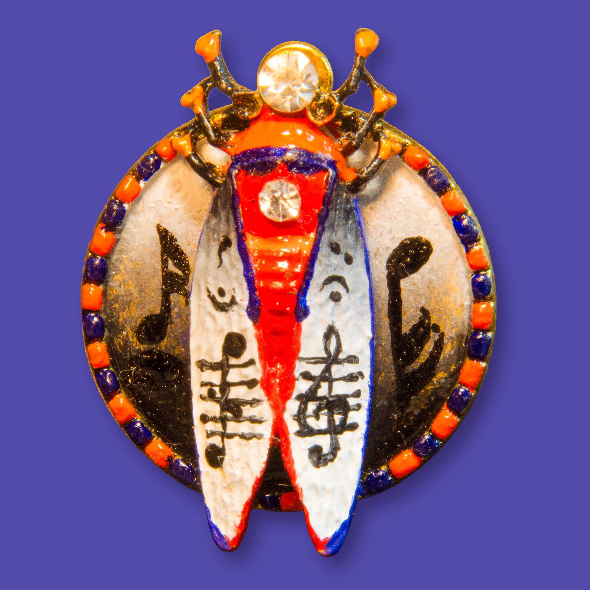 Decorative pendant with intricate designs on a blue background hand painted insect brooch, enamel beetle brooch, cicada brooch jewelry, rhinestone insect brooch, colorful bug brooch, artistic insect pin, handmade enamel brooch, statement insect jewelry, unique bug brooch, designer insect brooch, red black white beetle brooch, decorative insect pin, nature inspired brooch, collectible insect jewelry, whimsical bug brooch, vintage style insect brooch, artistic enamel insect pin, crystal insect brooch, handmad