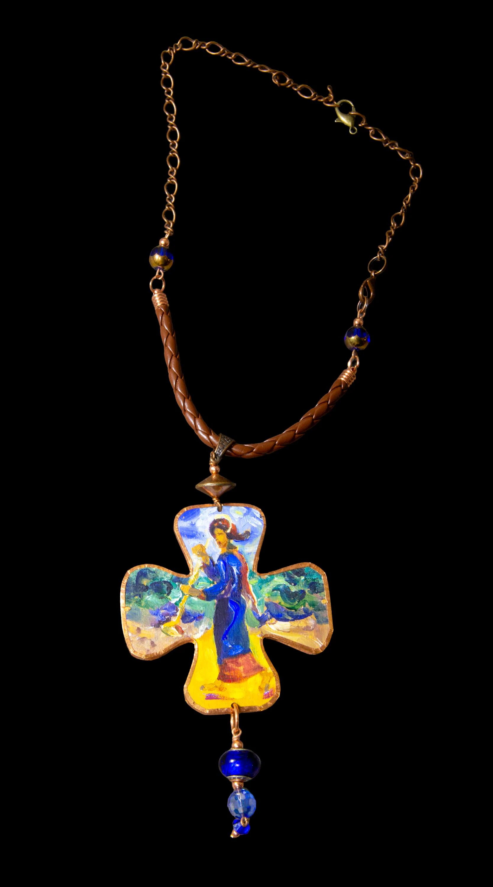 Decorative cross pendant with a figure on a chain against a black background Decorative cross-shaped pendant with a figurine on a dark background Unique artistic pendant for elegant woman, Hand painted miniature art pendant for women one of a kind jewelry, Luxury OOAK miniature painting necklace close up, Original artwork pendant by artist Marijus Piekuras, Fine art wearable pendant handcrafted detail, Tiny original painting inside pendant frame, Woman wearing one of a kind miniature pendant