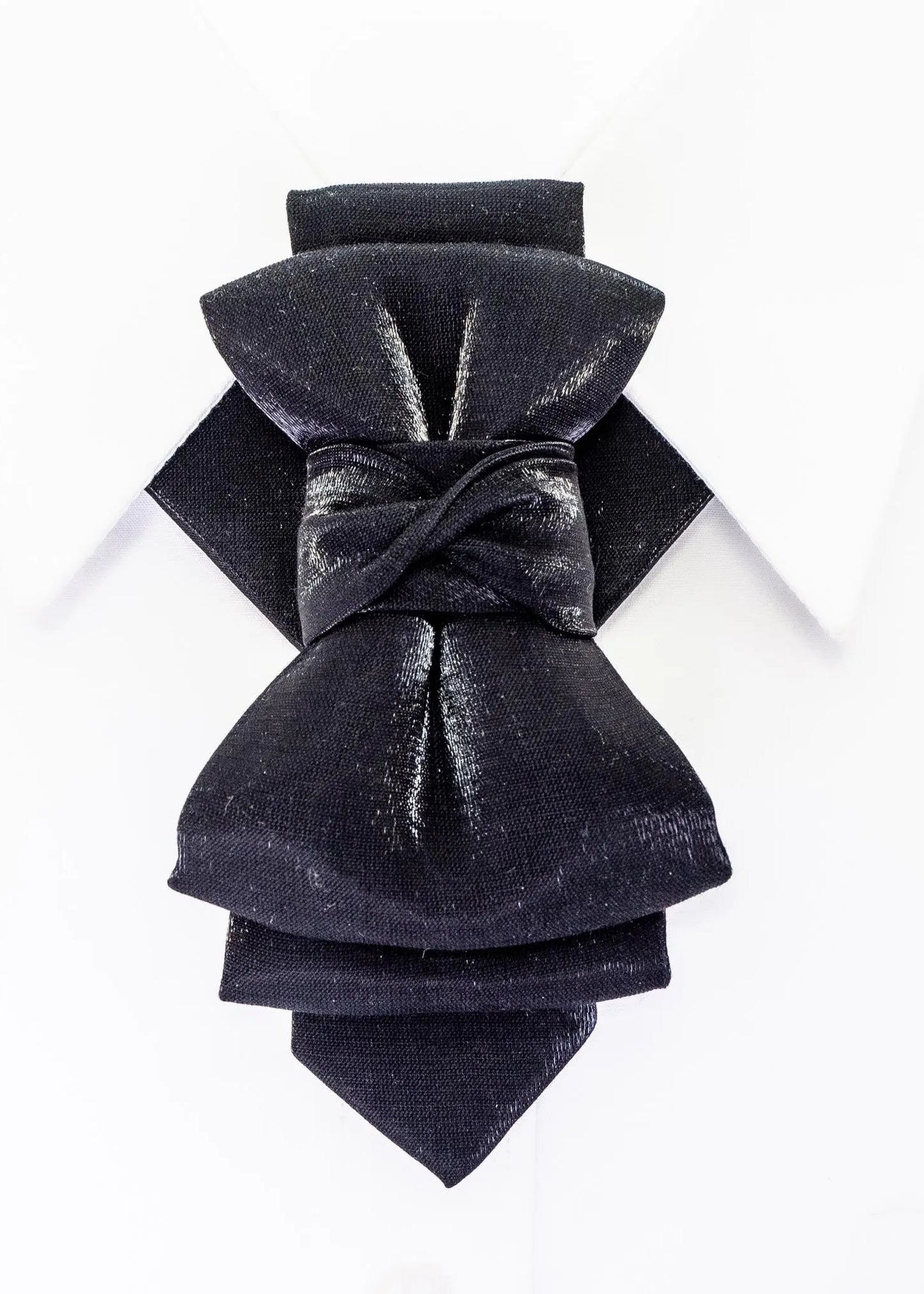 sculptural bow tie alternative, artistic groom tie, refined black necktie, luxury handmade necktie, standout wedding look, unique formal neckwear, contemporary cravat style tie, sophisticated men fashion, modern wedding tie, avant garde tie, elegant men accessory, tailored suit accessory, black statement tie for men, designer neckwear piece, premium fabric tie, formal event accessory, stylish groom outfit detail, minimalist black tie