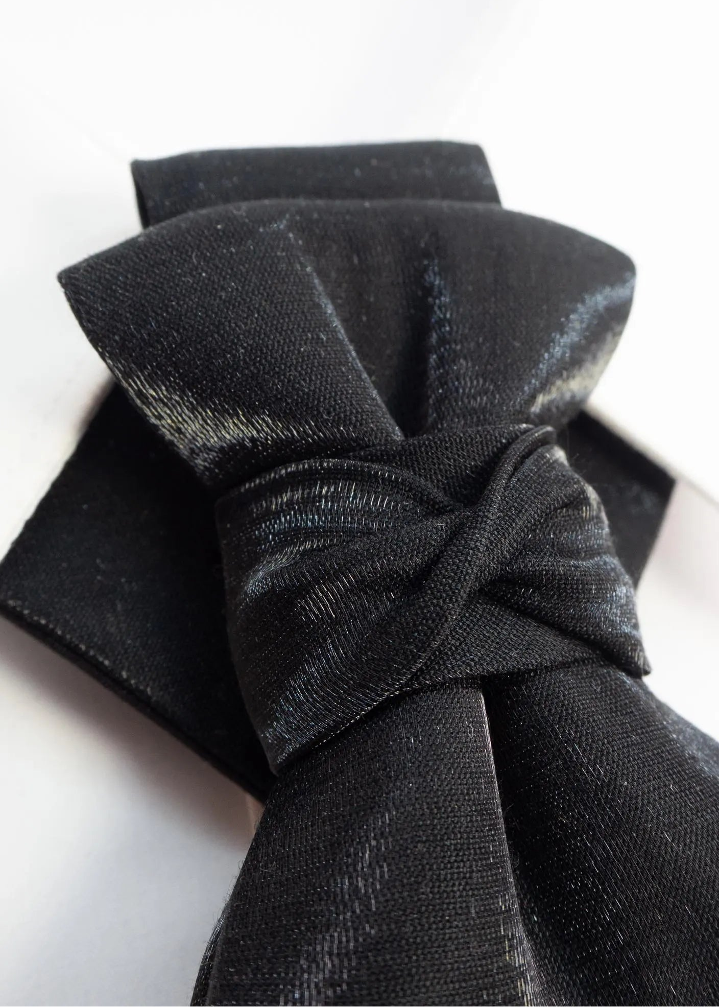 black statement tie for men, sculptural bow tie alternative, unique formal neckwear, artistic groom tie, modern wedding tie, luxury handmade necktie, sophisticated men fashion, elegant men accessory, designer neckwear piece, standout wedding look, contemporary cravat style tie, tailored suit accessory, refined black necktie, avant garde tie, formal event accessory, minimalist black tie, premium fabric tie, stylish groom outfit detail