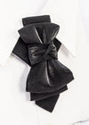 Black velvet bow on a white background black statement tie for men, sculptural bow tie alternative, unique formal neckwear, artistic groom tie, modern wedding tie, luxury handmade necktie, sophisticated men fashion, elegant men accessory, designer neckwear piece, standout wedding look, contemporary cravat style tie, tailored suit accessory, refined black necktie, avant garde tie, formal event accessory, minimalist black tie, premium fabric tie, stylish groom outfit detail