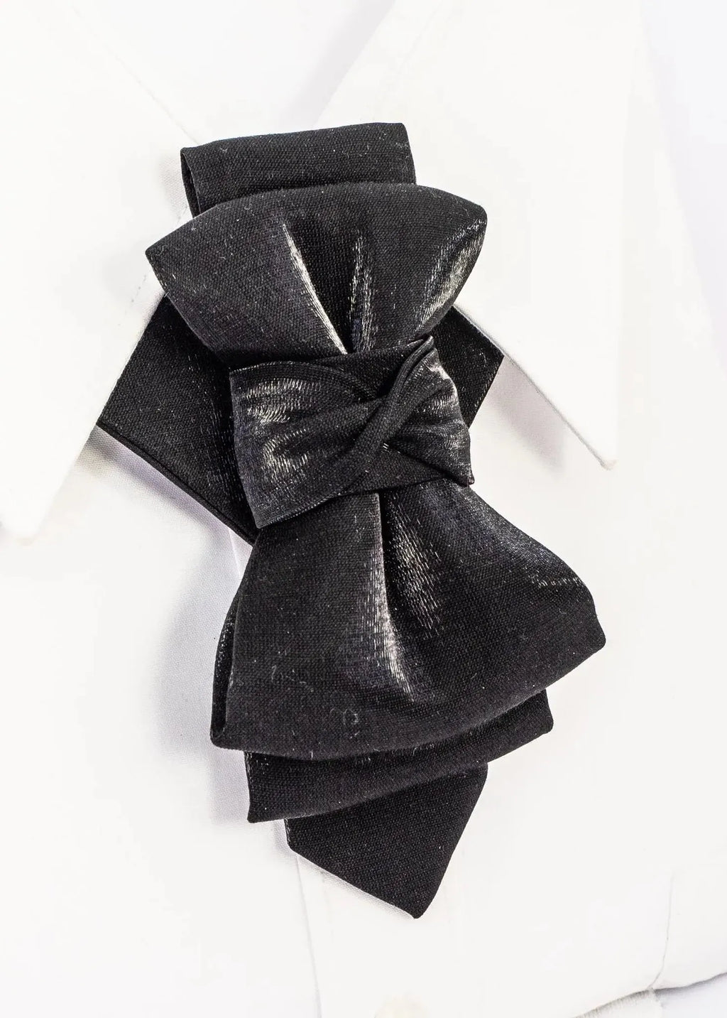 Black velvet bow on a white background black statement tie for men, sculptural bow tie alternative, unique formal neckwear, artistic groom tie, modern wedding tie, luxury handmade necktie, sophisticated men fashion, elegant men accessory, designer neckwear piece, standout wedding look, contemporary cravat style tie, tailored suit accessory, refined black necktie, avant garde tie, formal event accessory, minimalist black tie, premium fabric tie, stylish groom outfit detail