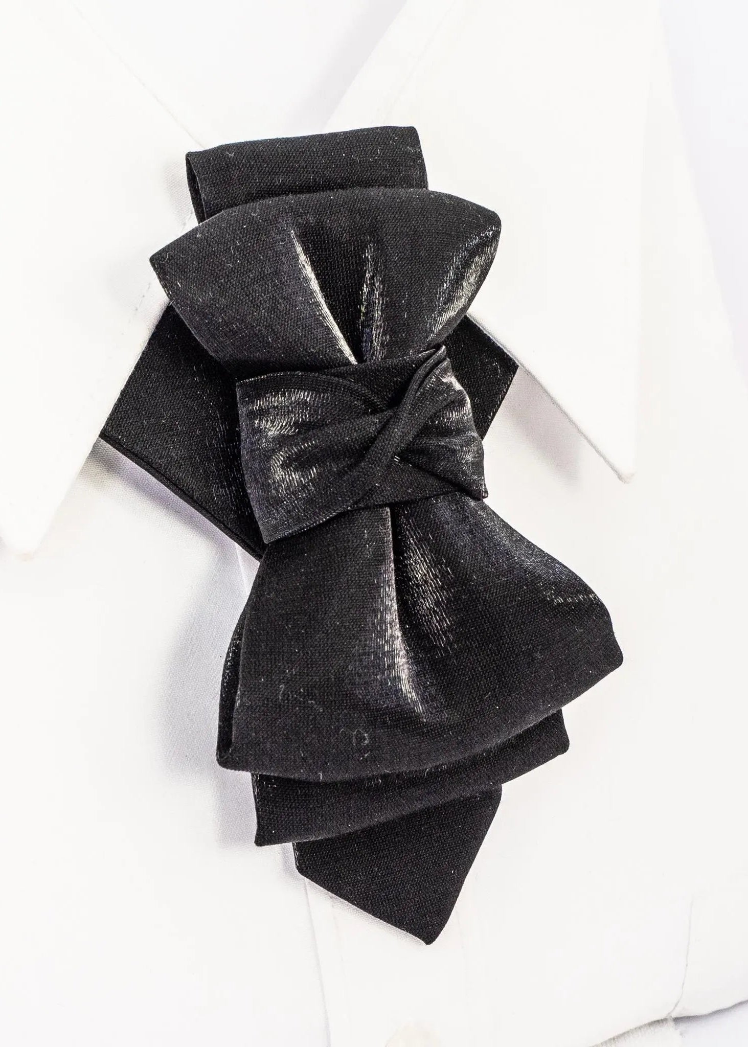 Black velvet bow on a white background black statement tie for men, sculptural bow tie alternative, unique formal neckwear, artistic groom tie, modern wedding tie, luxury handmade necktie, sophisticated men fashion, elegant men accessory, designer neckwear piece, standout wedding look, contemporary cravat style tie, tailored suit accessory, refined black necktie, avant garde tie, formal event accessory, minimalist black tie, premium fabric tie, stylish groom outfit detail