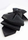 Black bow tie on a white background black statement tie for men, sculptural bow tie alternative, unique formal neckwear, artistic groom tie, modern wedding tie, luxury handmade necktie, sophisticated men fashion, elegant men accessory, designer neckwear piece, standout wedding look, contemporary cravat style tie, tailored suit accessory, refined black necktie, avant garde tie, formal event accessory, minimalist black tie, premium fabric tie, stylish groom outfit detail