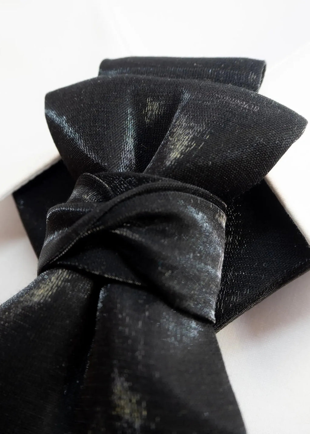black statement tie for men, sculptural bow tie alternative, unique formal neckwear, artistic groom tie, modern wedding tie, luxury handmade necktie, sophisticated men fashion, elegant men accessory, designer neckwear piece, standout wedding look, contemporary cravat style tie, tailored suit accessory, refined black necktie, avant garde tie, formal event accessory, minimalist black tie, premium fabric tie, stylish groom outfit detail