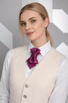 Woman wearing a beige vest and white shirt with a purple bow tie against a geometric patterned wall Woman wearing a cream vest over a white shirt with a purple bow tie against a geometric patterned  fashionable, elegant, sophisticated, chic, modern, unique, exclusive, luxurious, high-end, premium, quality, handmade, artisan, bespoke, tailored, custom, designer, trendy, vogue, modish, smart, classy, stylish, fashion-forward, contemporary, women's fashion, ladies' wear, apparel, clothing, attire, garment, out