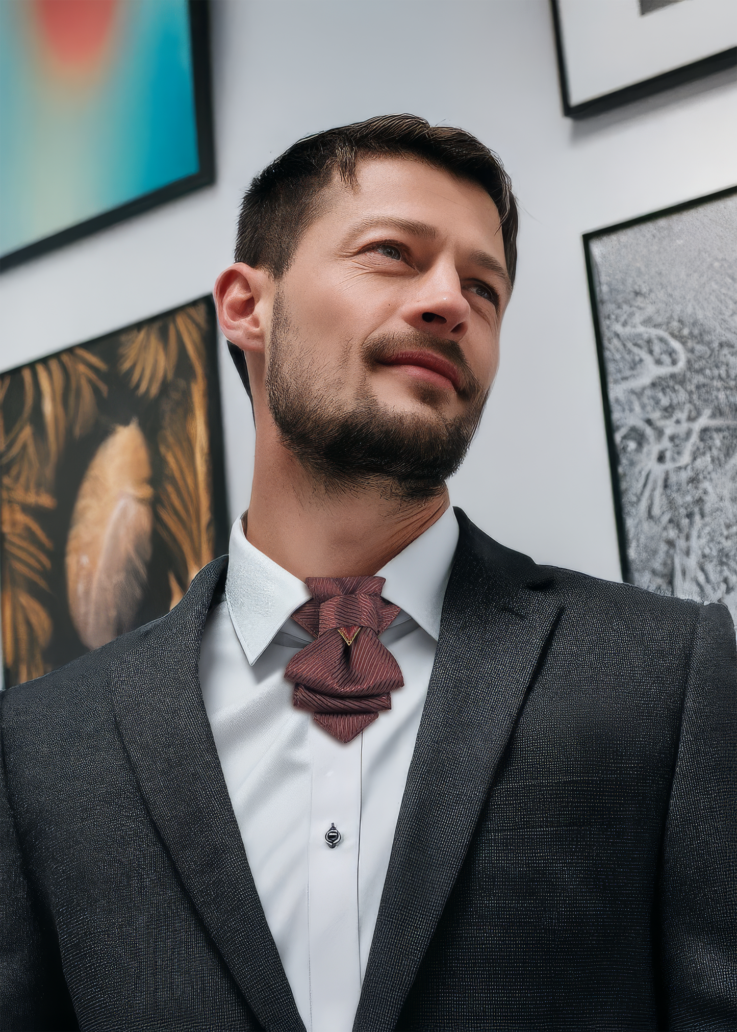 Man wearing a dark suit and patterned tie in an art gallery setting uxury necktie, handmade tie, burgundy tie, wedding tie, groom accessory, musician tie, performer tie, stage outfit, unique neckwear, layered necktie, formal wear, luxury menswear, wine red tie, striped tie, gala accessory, mens fashion, artistic tie, luxury wedding accessory, Bow Tie, Tie for wedding suite SHIRAZ hopper tie Bow tie