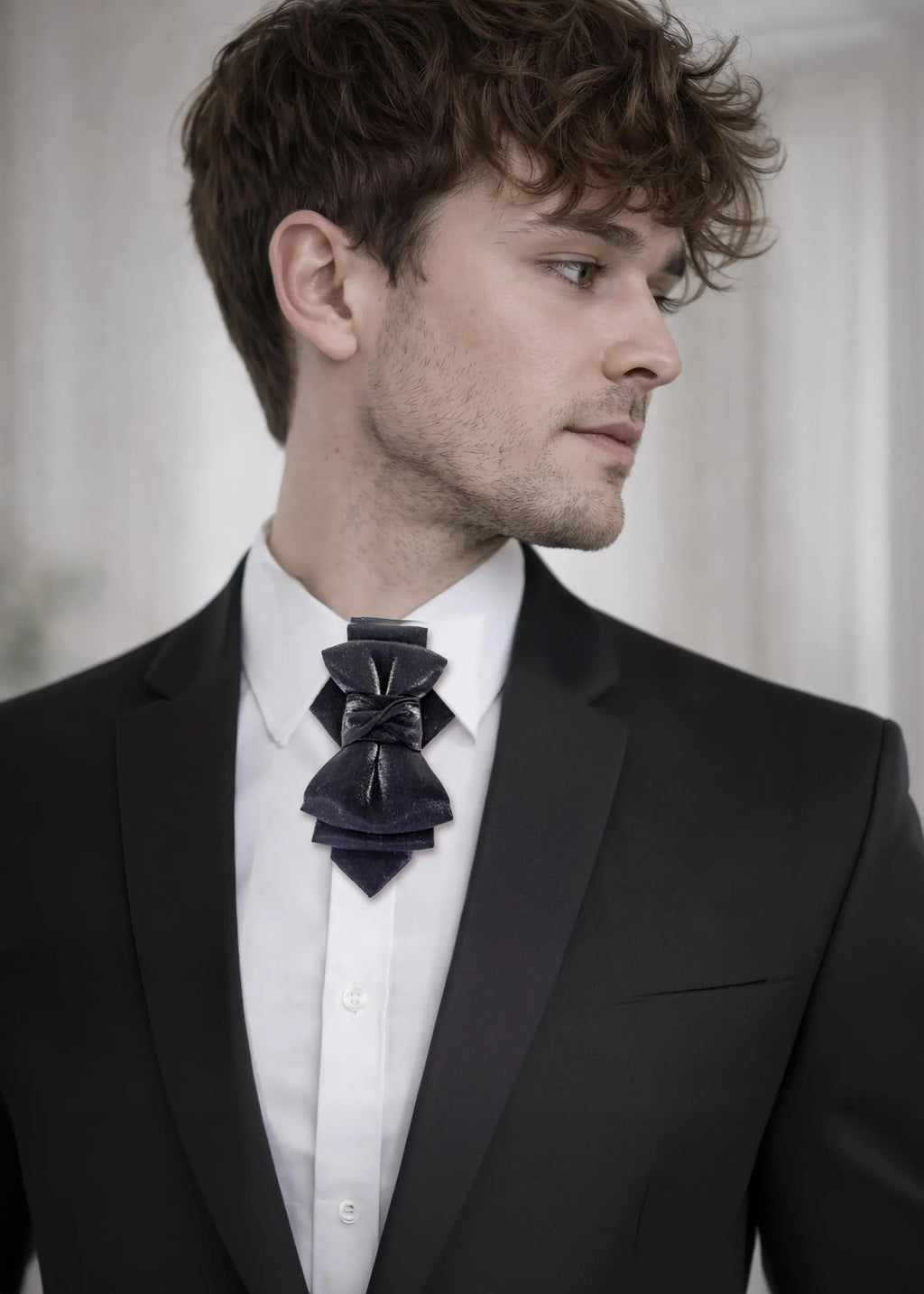 black statement tie for men, luxury handmade necktie, artistic groom tie, modern wedding tie, unique formal neckwear, sculptural bow tie alternative, elegant men accessory, minimalist black tie, stylish groom outfit detail, contemporary cravat style tie, designer neckwear piece, formal event accessory, premium fabric tie, sophisticated men fashion, standout wedding look, avant garde tie, tailored suit accessory, refined black necktie