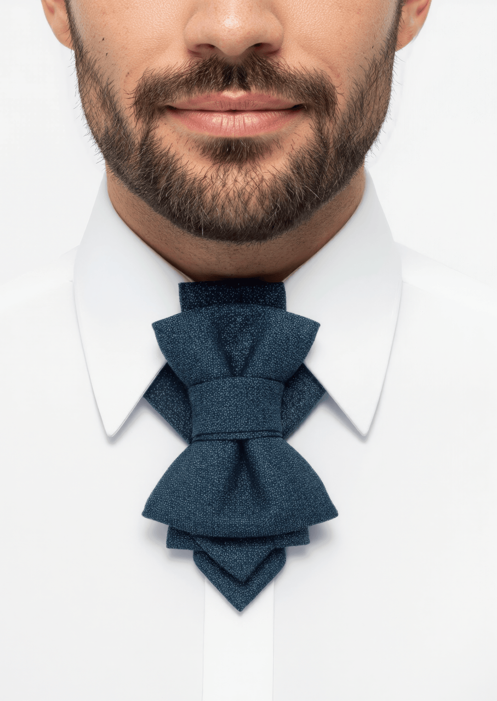 Man wearing a white shirt with a blue bow tie against a white background uxury handmade men necktie, modern bow tie for men, unique men neck accessory, blue textured bow tie, designer men necktie, artistic men bow tie, formal men neckwear, elegant men necktie detail, handmade bow tie on white shirt, statement men fashion accessory, contemporary men necktie, unisex artistic necktie, premium fabric bow tie, minimalist men style accessory, modern groom necktie, musician stage necktie, high fashion men bow tie,