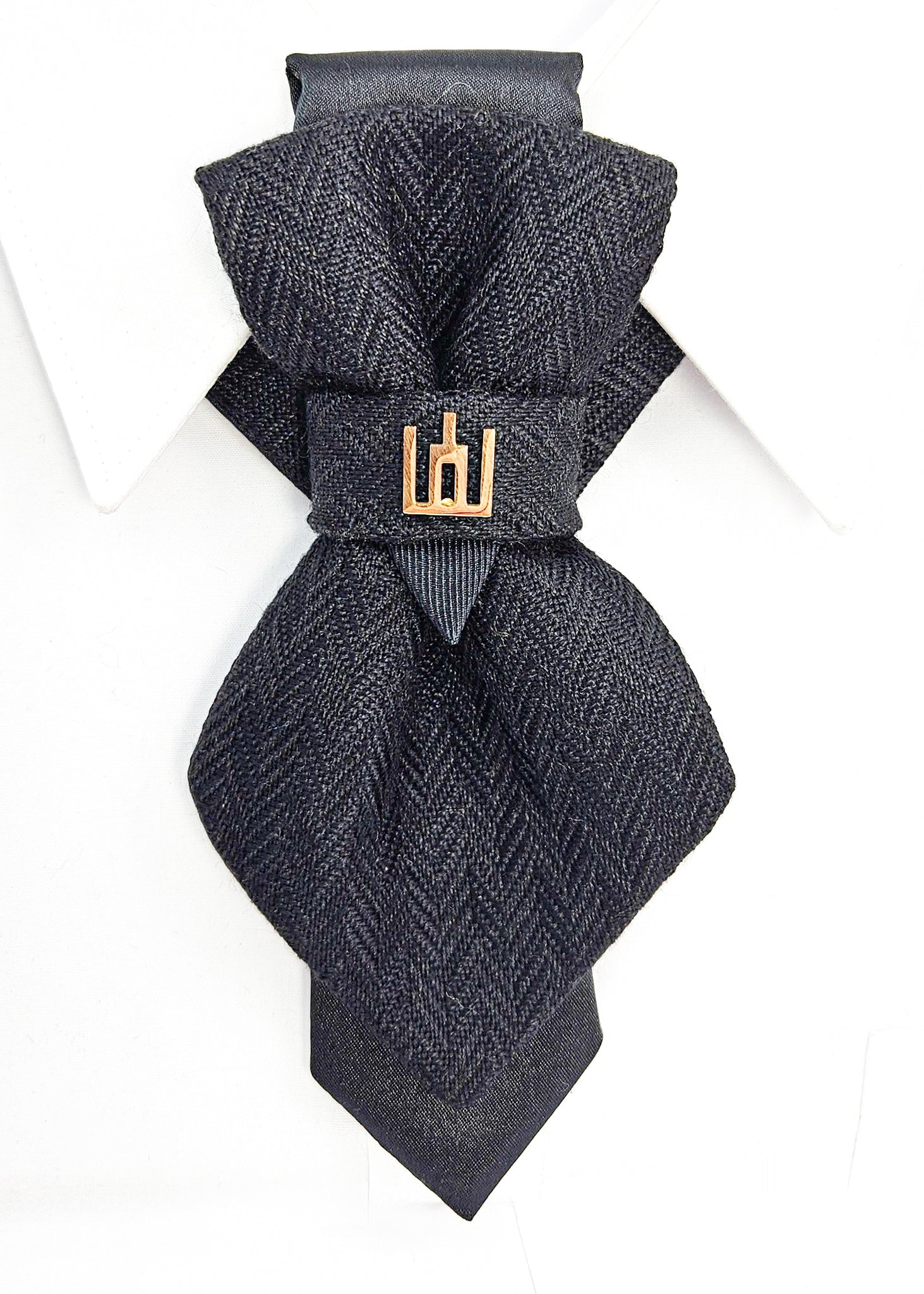 Black patterned tie with a gold clasp background Handmade luxury dark navy blue wool bow tie with leather neck strap and unique gold-tone monogrammed clip. Pre-tied cravat for groom, weddings, formal events, and special occasions. Perfect sophisticated men's accessory.
