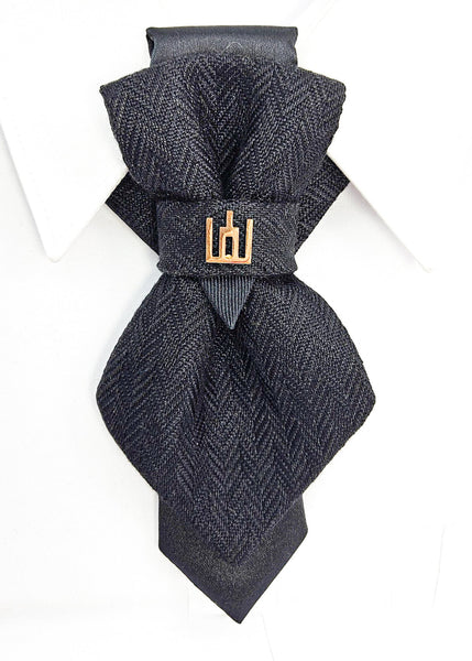 Black patterned tie with a gold clasp background Handmade luxury dark navy blue wool bow tie with leather neck strap and unique gold-tone monogrammed clip. Pre-tied cravat for groom, weddings, formal events, and special occasions. Perfect sophisticated men's accessory.