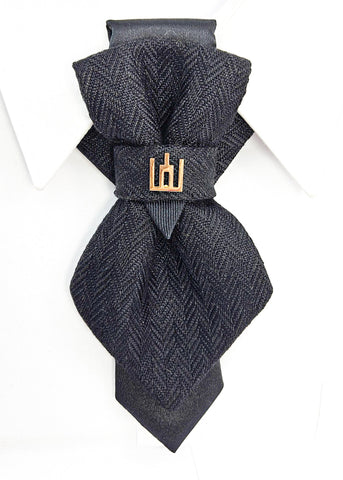 Black patterned tie with a gold clasp background Handmade luxury dark navy blue wool bow tie with leather neck strap and unique gold-tone monogrammed clip. Pre-tied cravat for groom, weddings, formal events, and special occasions. Perfect sophisticated men's accessory.