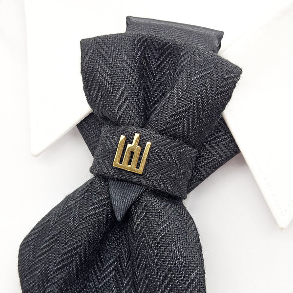 Gray herringbone scarf with a gold clasp on a white background