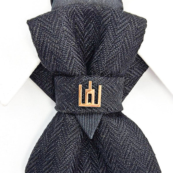 Dark gray textured bow tie with a gold clasp on a white background Handmade luxury dark navy blue wool bow tie with leather neck strap and unique gold-tone monogrammed clip. Pre-tied cravat for groom, weddings, formal events, and special occasions. Perfect sophisticated men's accessory.