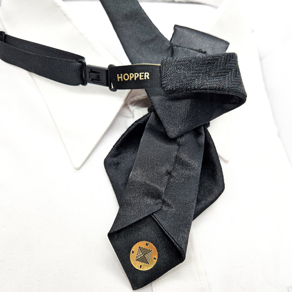 Gray tie with a visible brand label on a white background