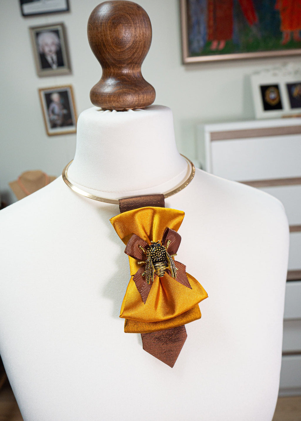 Elegant gold bow tie for women styled as a formal neck accessory